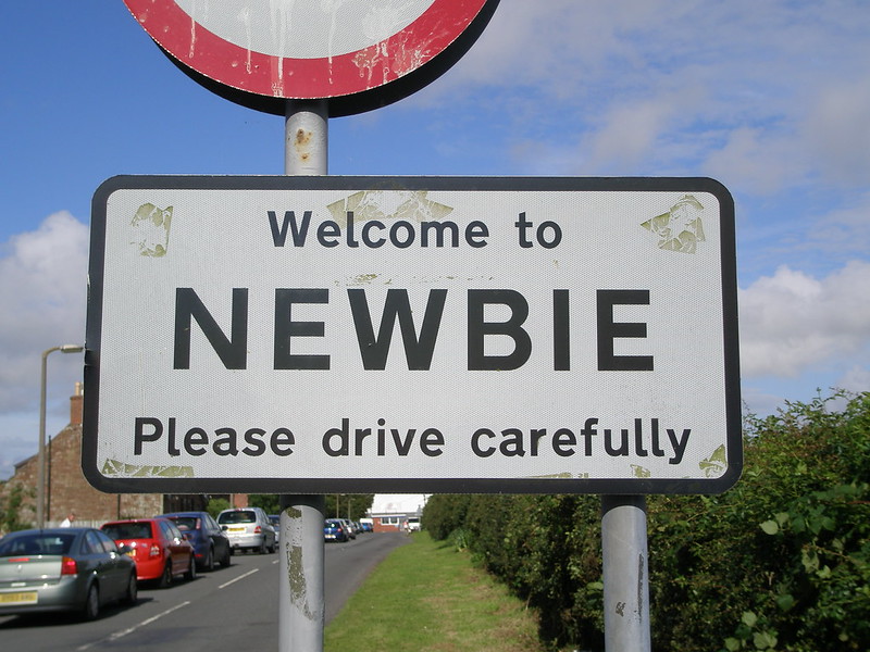 A road sign welcoming a driver to the town of Newbie